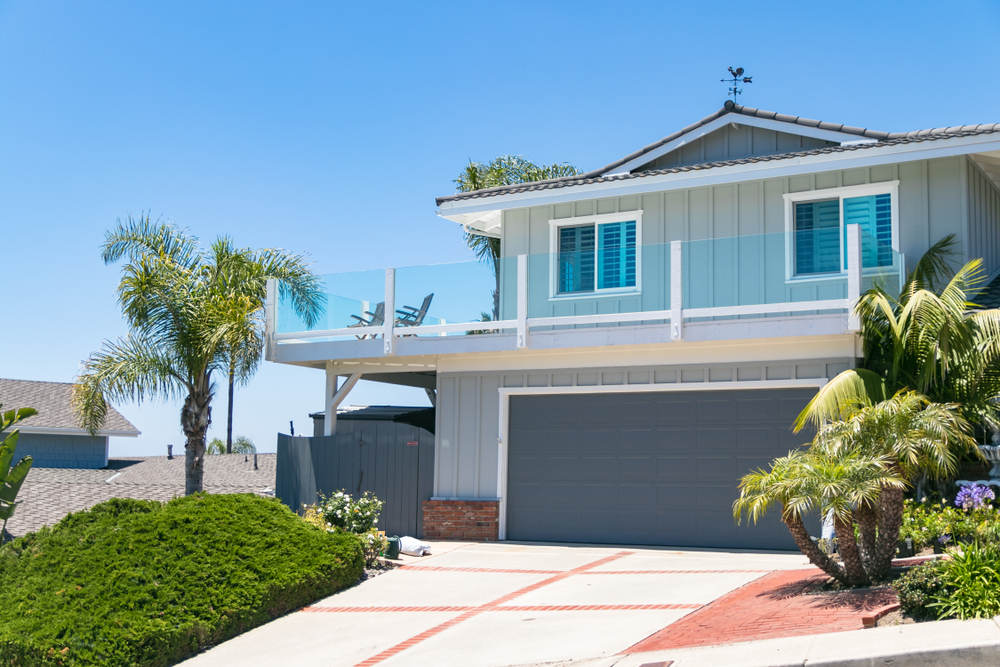 House with new vinyl replacement windows - How Do Replacement Windows Increase Your Home’s Value